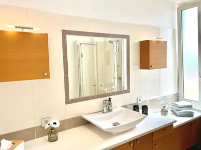 a bathroom with a sink and a mirror at Top emplacement centre Cannes in Cannes