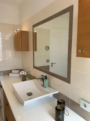 a bathroom with a white sink and a mirror at Top emplacement centre Cannes in Cannes