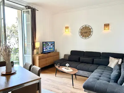 a living room with a couch and a table at Top emplacement centre Cannes in Cannes
