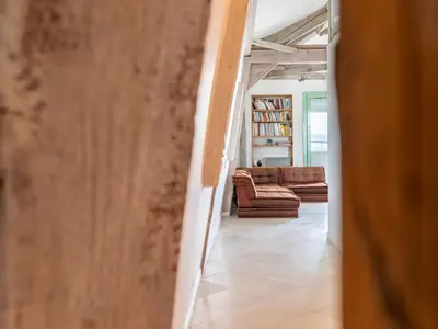 a hallway with a living room with a couch at Apartment Les Araucarias by Interhome in Cannes