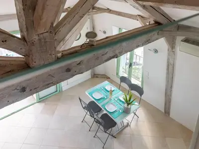 an overhead view of a dining room with a table and chairs at Apartment Les Araucarias by Interhome in Cannes