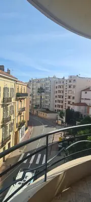 a view of a city street from a balcony at STUDIO CANNES STELLAMARE in Cannes