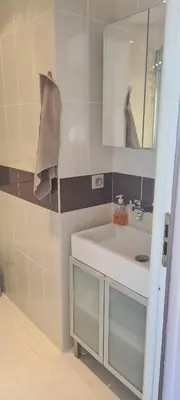 a bathroom with a sink and a mirror at STUDIO CANNES STELLAMARE in Cannes