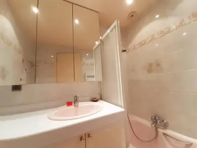 a bathroom with a sink and a toilet and a mirror at Trident in Cannes