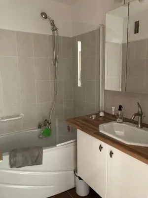 a bathroom with a tub and a sink and a shower at Appart proche plage avec grand balcon in Cannes