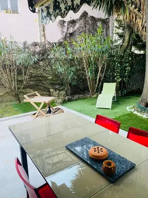 a glass table with a bowl on top of it at 3 pièces terrasse, jardin in Cannes