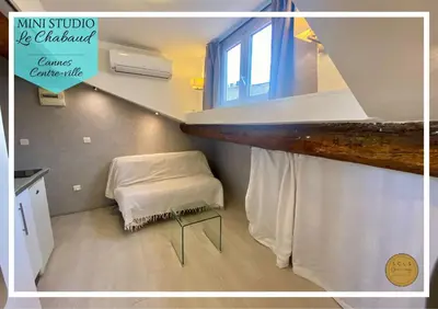 a small room with a bed and a window at Mini Studio - Le Chabaud - Cannes centre in Cannes