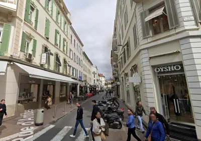 a group of people walking down a city street at Le Chabaud - Cannes centre in Cannes