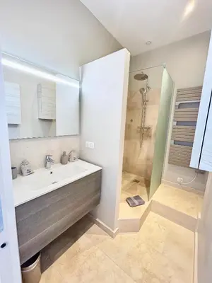 a bathroom with a sink and a shower at Cannes Vidal Rue Antibes SNCF station 2 mn 1 BR new 2024 quiet building hyper center by Olam Properties in Cannes