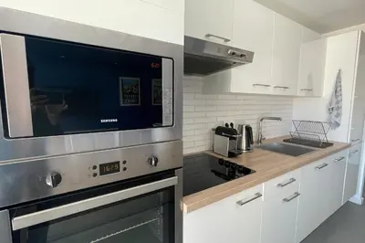 a kitchen with a microwave oven and a sink at Stunning 1 BR 3 pers Résidence Cannes Suquet Vieux Port Croisette 1 mn by Olam Properties in Cannes
