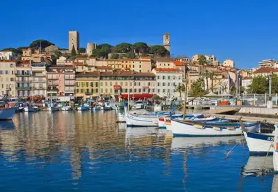 a group of boats docked in a harbor with buildings at 2 pièces 2 terrasses 100 m Croisette très clair. in Cannes