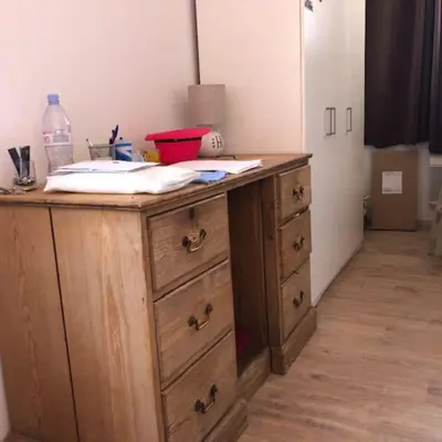 a wooden desk with drawers in a room at 2 pièces 2 terrasses 100 m Croisette très clair. in Cannes