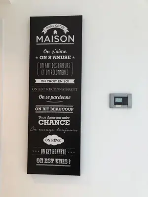 a chalkboard menu for a restaurant on a wall at Appartement montfleury, 2 terrasses, 2 chambres , 2 sdb , pkg privé piscine, 15 min walk to Croisette beach and Palais des festivals in Cannes