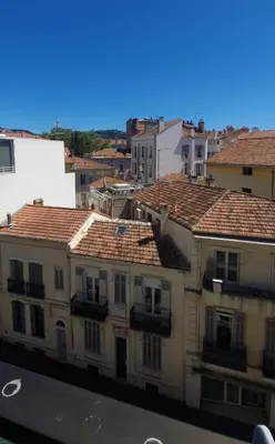 a group of buildings with red tile roofs at 2 pièces avec terrasse -Calme-Sans vis à vis-garage-centre de Cannes in Cannes
