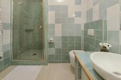 a bathroom with a shower and a sink and a toilet at Palais Miramar - Suite Blue Room - Vue Mer -Croisette Emplacement Unique - 20M Plage - WIFI - Clim in Cannes