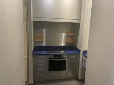 a kitchen with a stove and a blue counter top at Appartement Cannes Centre - Palais du Festival in Cannes