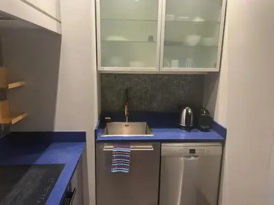 a kitchen with a sink and a blue counter top at Appartement Cannes Centre - Palais du Festival in Cannes
