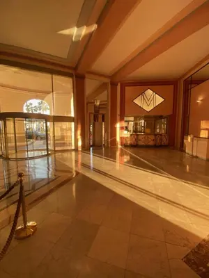 a empty lobby with a dance floor in a building at Palais Miramar Suite Art Modern - Derniere étages Vue Mer - 75m de confort - En Face des Plages -WIFI - Clim in Cannes