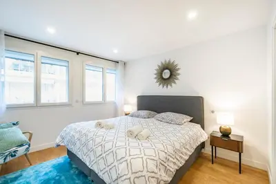 a bedroom with a bed with two white towels on it at Elégant - Hypercentre - Croisette - Palais - AK in Cannes