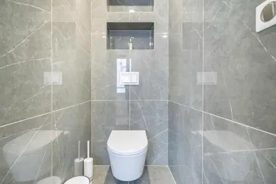 a bathroom with a toilet and a shower stall at Elégant - Hypercentre - Croisette - Palais - AK in Cannes