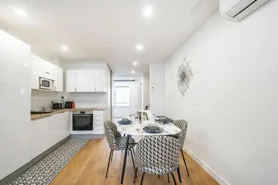 a kitchen with a table and chairs in a room at Elégant - Hypercentre - Croisette - Palais - AK in Cannes