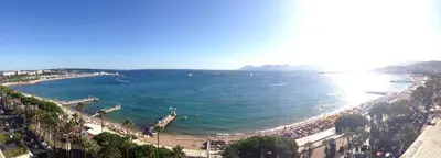 a view of a beach with people on it at Palais Miramar - Suite & B31 - Croisette Emplacement Unique - 20M Plage - WIFI - Clim in Cannes
