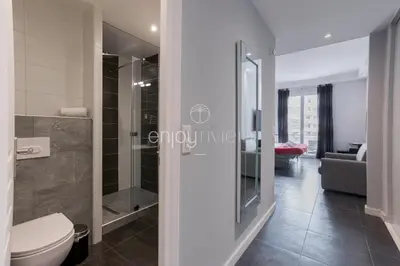 a bathroom with a toilet and a walk in shower at Palais Miramar - Suite & B31 - Croisette Emplacement Unique - 20M Plage - WIFI - Clim in Cannes