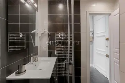 a bathroom with a sink and a shower at Palais Miramar - Suite & B31 - Croisette Emplacement Unique - 20M Plage - WIFI - Clim in Cannes