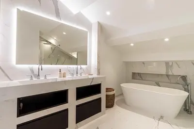 a bathroom with a tub and a large mirror at Sumptuous renovated Penthouse - Gray d'Albion-Croi in Cannes