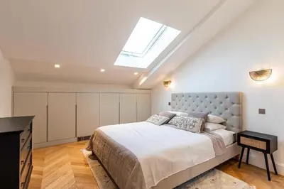 a bedroom with a large bed and a skylight at Sumptuous renovated Penthouse - Gray d'Albion-Croi in Cannes