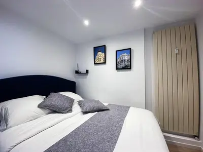 a bedroom with a bed with two pillows on it at CROISETTE VUE MER LATERALE in Cannes