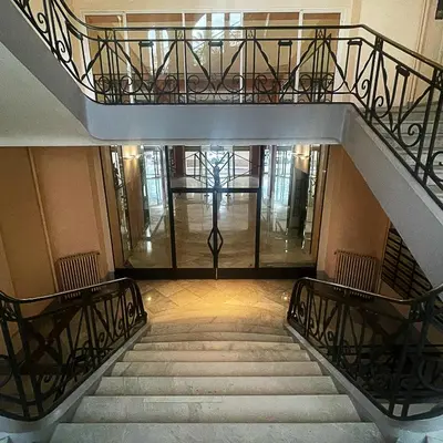 a staircase in a building with a stair case at CROISETTE VUE MER LATERALE in Cannes