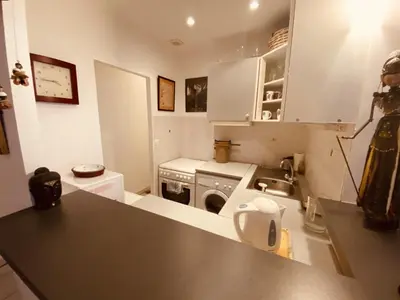 a kitchen with a counter top and a sink at 2 bedroom apartment in the heart of Cannes air conditioning easy walk to the Palais des Festivals - 2015 in Cannes