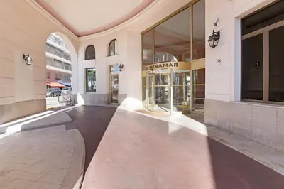 a lobby of a building with a large glass window at Palais Miramar - Suite & E37 - 20M Plage - Croisette Emplacement Unique - WIFI - Clim in Cannes