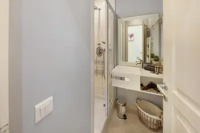 a bathroom with a sink and a shower at Palais Miramar - Suite & E37 - 20M Plage - Croisette Emplacement Unique - WIFI - Clim in Cannes