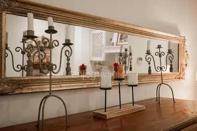 a group of candles on display in front of a mirror at Palais Miramar - Suite & E37 - 20M Plage - Croisette Emplacement Unique - WIFI - Clim in Cannes