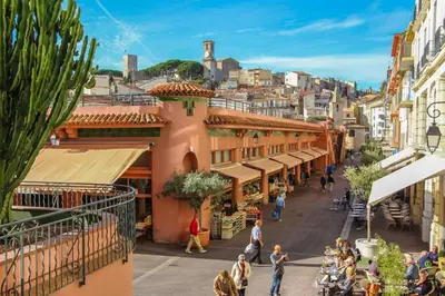 a group of people walking down a street in a city at Sea View & Large Terrace LIVE IN LA VISTA in Cannes