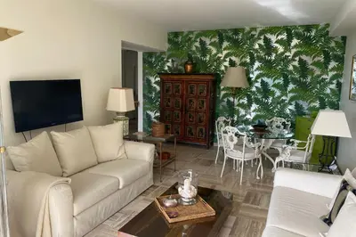 a living room with a couch and a table at Sea View & Large Terrace LIVE IN LA VISTA in Cannes