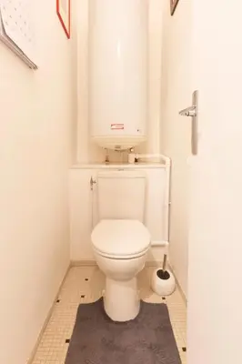 a bathroom with a white toilet with a sink at Le Gallia haven of peace in the city center with Terrace GALLIA LYS in Cannes