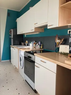 a kitchen with white cabinets and a dishwasher at Le Gallia haven of peace in the city center with Terrace GALLIA LYS in Cannes