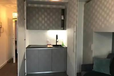 a kitchen with a sink and a counter top at Design studio terrace and beach LIVE IN MARLYNE in Cannes