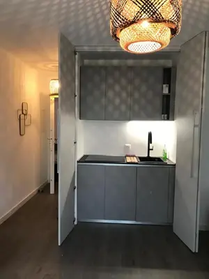 a kitchen with a sink and a counter top at Design studio terrace and beach LIVE IN MARLYNE in Cannes