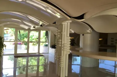 a room with a ceiling with columns and windows at WE CANNES ! Terrace sea view swimming pool car park Cannes Center in Cannes