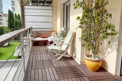 a patio with a table and chairs on a balcony at Sublime Apartment Center Croisette LIVE IN Moliere in Cannes