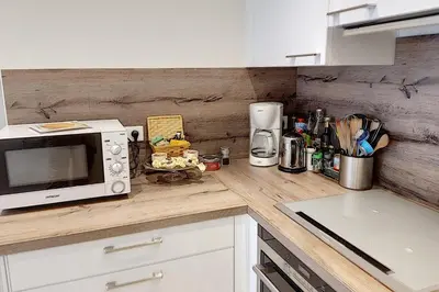 a kitchen with a microwave and a counter top at Sublime Apartment Center Croisette LIVE IN Moliere in Cannes