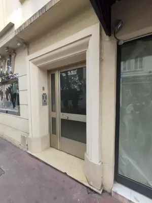a building with a glass door on the side of it at Sublime Apartment Center Croisette LIVE IN Moliere in Cannes