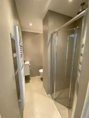 a bathroom with a shower and a toilet at Exceptional Cannes Center sea view and swimming pool LIVE IN PARC BRUYERE in Cannes