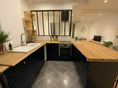 a kitchen with a sink and a counter top at Superbe 2 pièces lumineux - Cannes Gare in Cannes