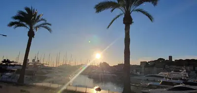 a table with two plates of food and glasses of wine at Cannes suquet Croisette in Cannes