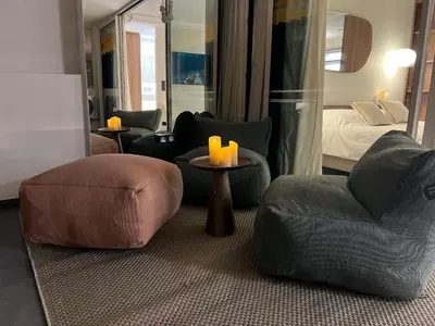 a living room with two chairs and a bed at Palm croisette front de mer1 in Cannes